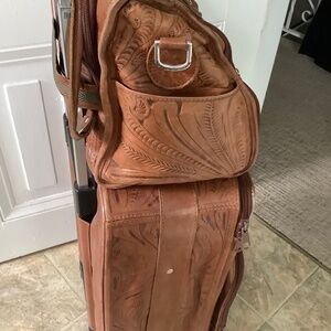 Hand tooled leather carryon luggage